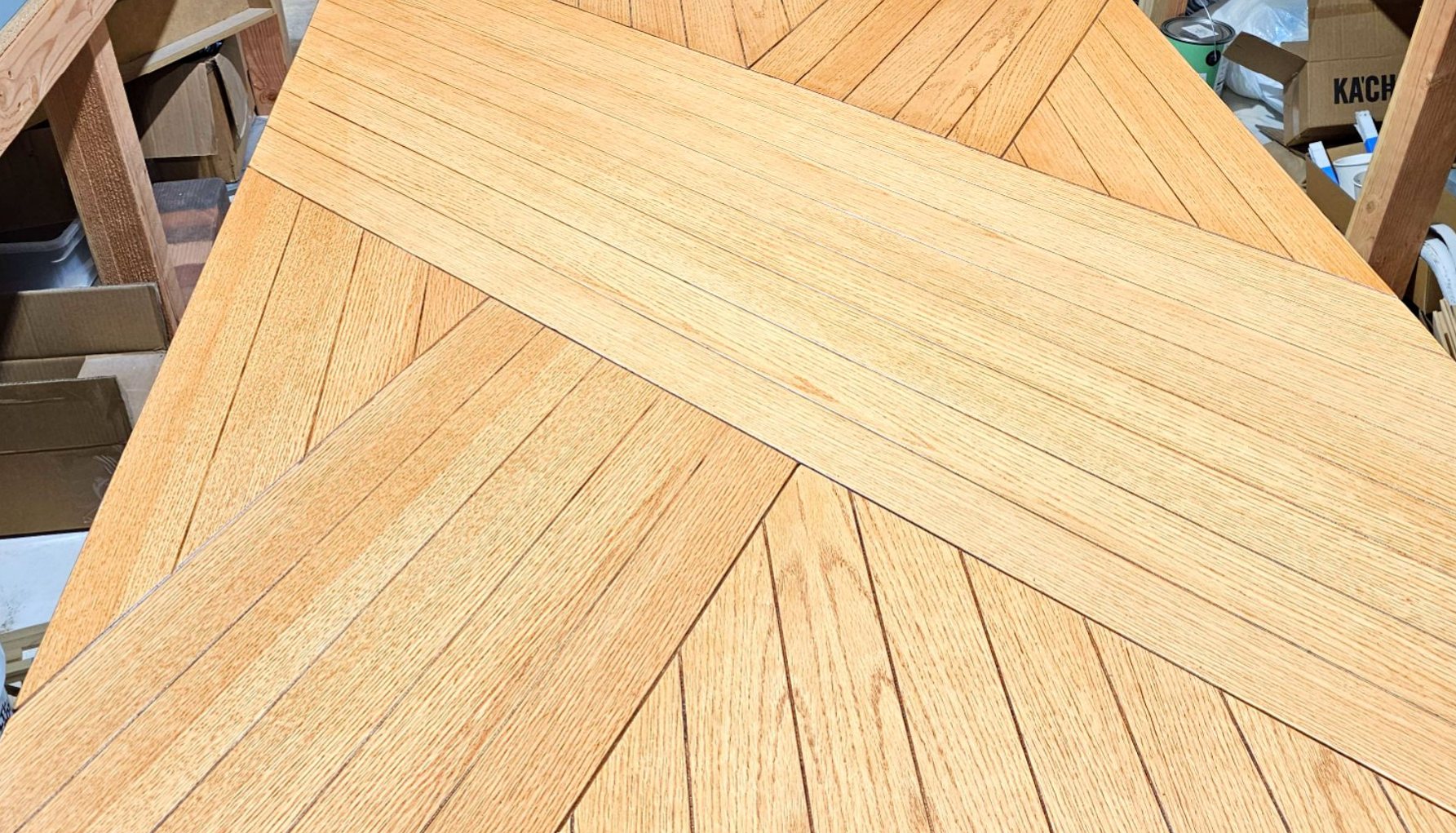Chevron-patterned wood panel in the shop