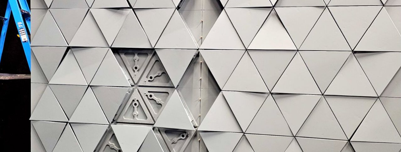 Modular triangular wall panels, some removed to show mounts