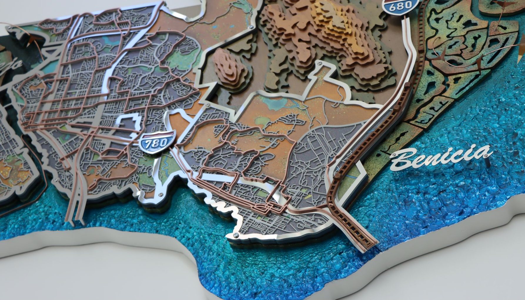 Map detail of Benicia with textured aluminum water and copper transit lines